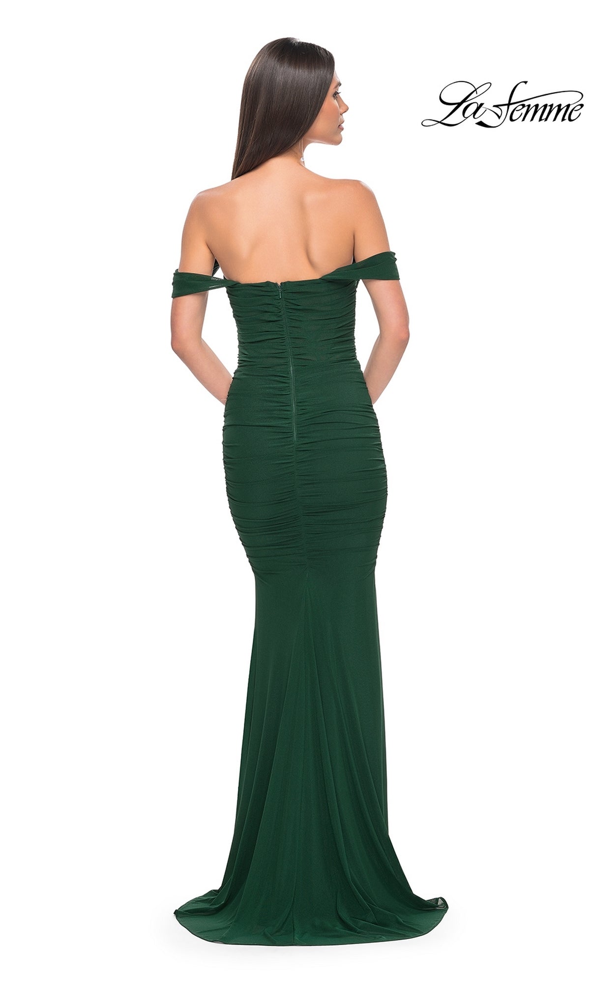 Woman modeling the La Femme Off-the-Shoulder Long Prom Dress 31914, a fitted dark green formal gown with ruched detailing, shown from the back.